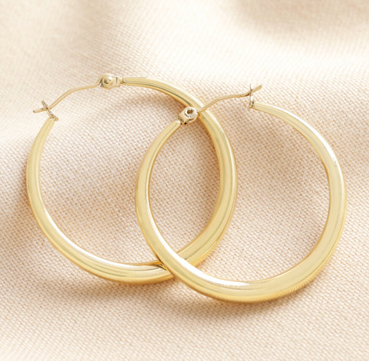 Large tapered gold hoop earrings