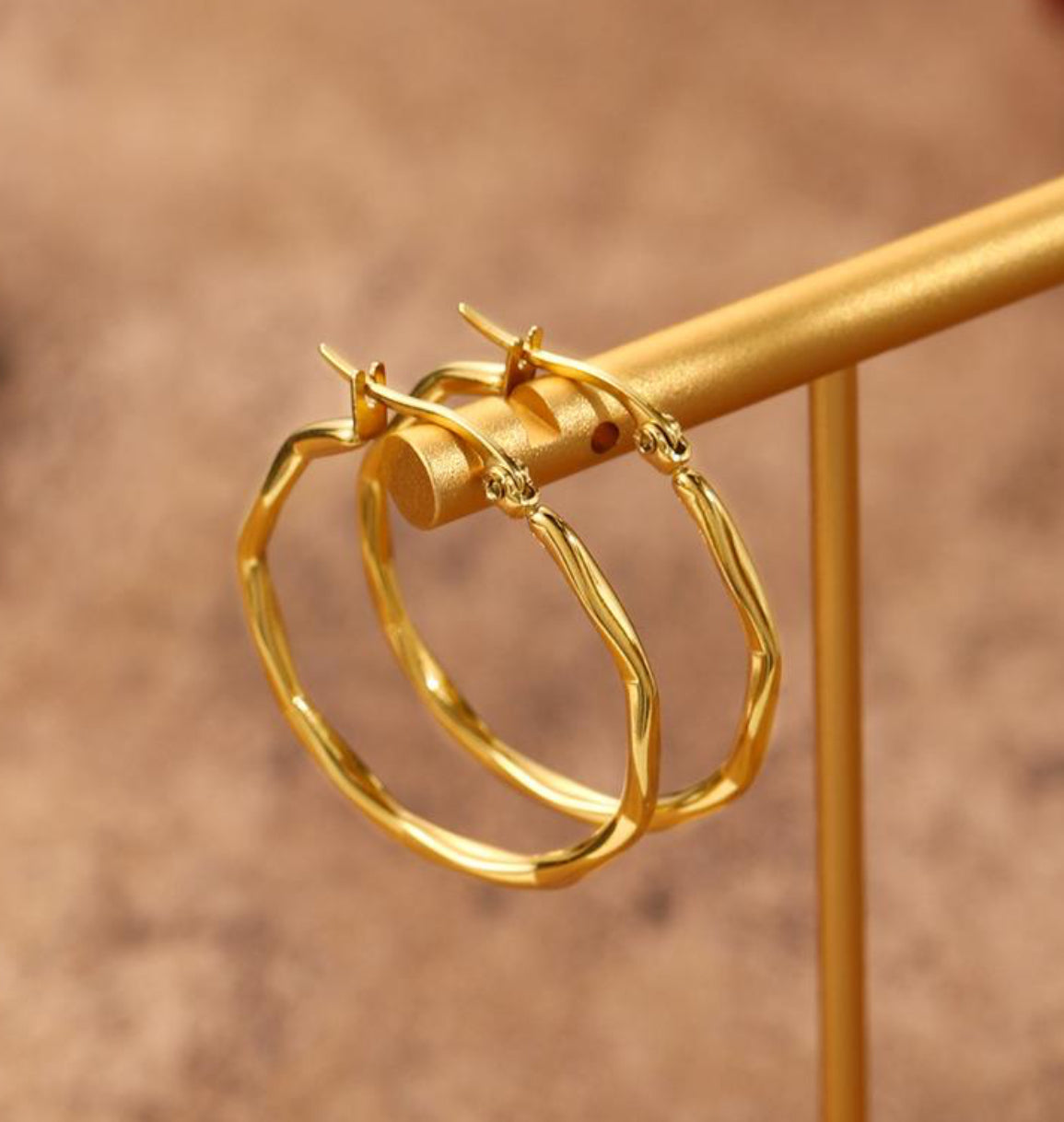 Twisted hoop gold earrings