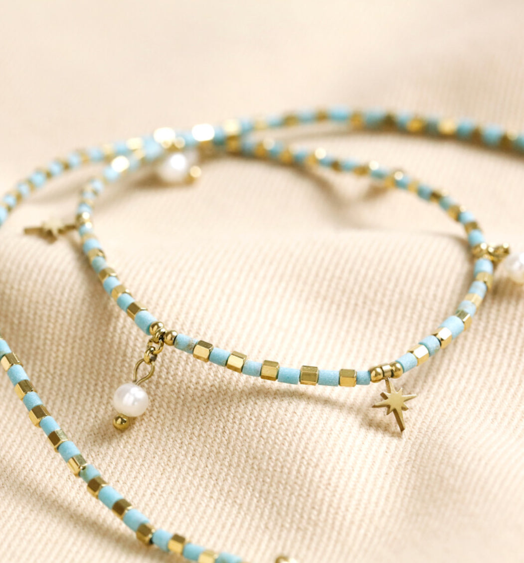 Blue bead star and pearl charm necklace in gold