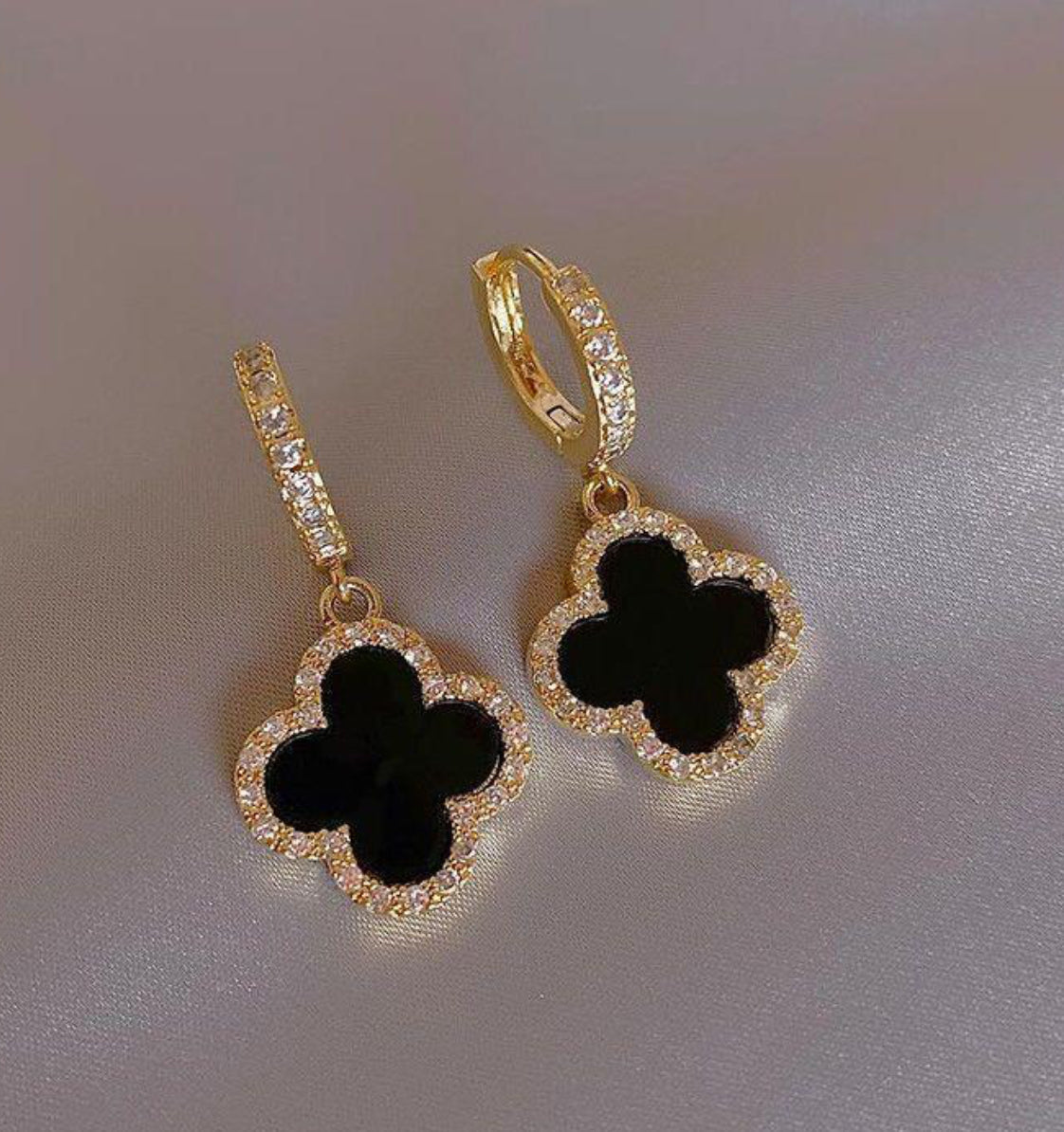Crystal encrusted clover huggie earrings in black