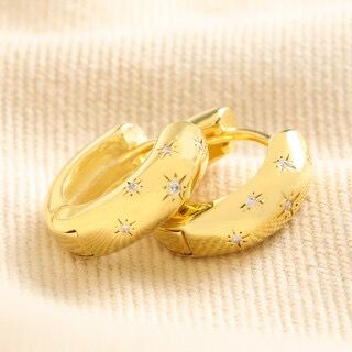 Scattered crystal stars chunky huggie hoop earrings in gold